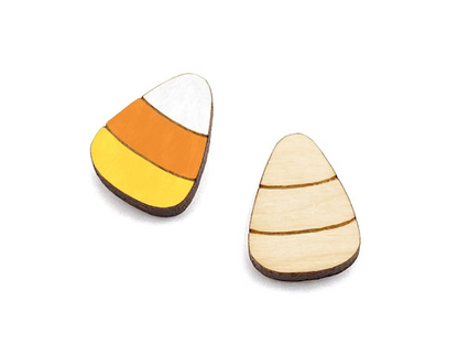 a pair of wooden cabochon stud earring blanks cut and engraved to look like candy corn