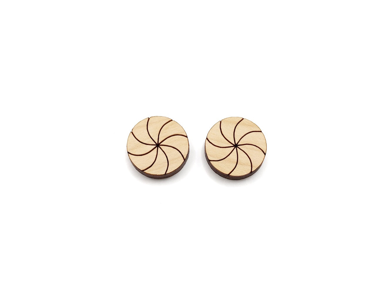 a pair of wooden cabochon stud earring blanks cut and engraved to look like peppermint candies