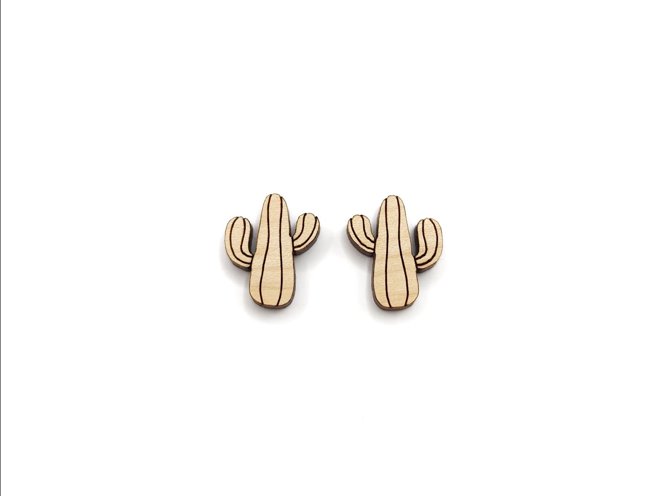 a pair of wooden cabochon stud earring blanks cut and engraved to look like a saguaro cactus