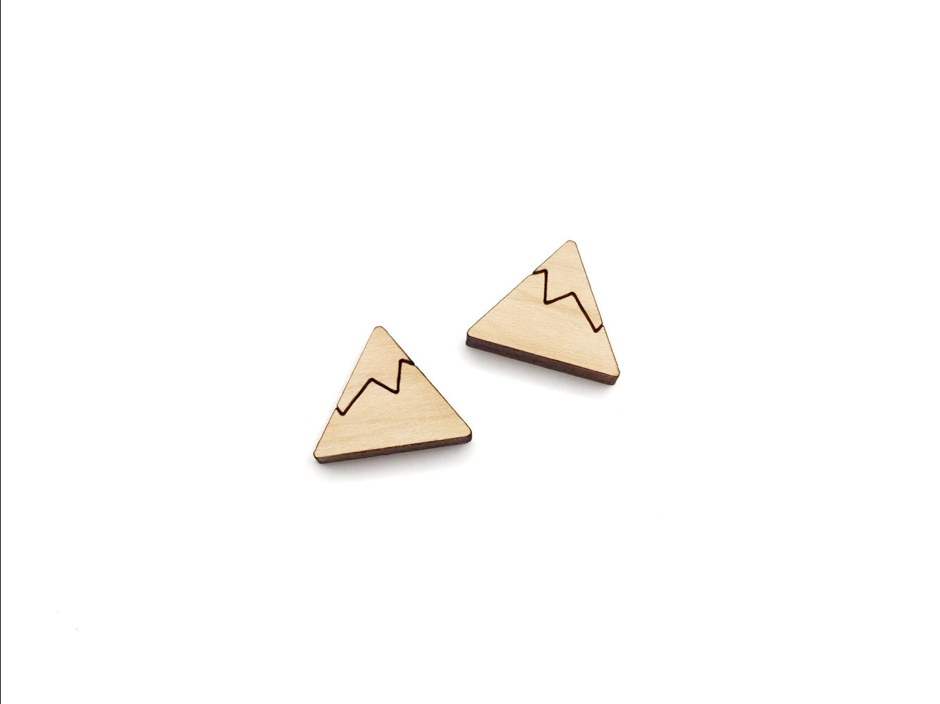 a pair of wooden cabochon stud earring blanks cut and engraved to look like a snow-capped mountain