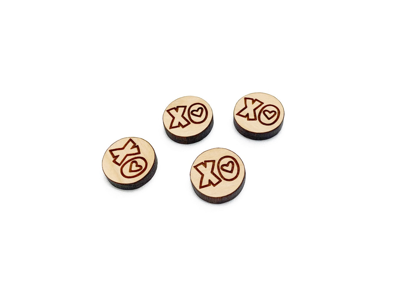 two pairs of round wooden cabochon earring blanks engraved with an XO Heart design