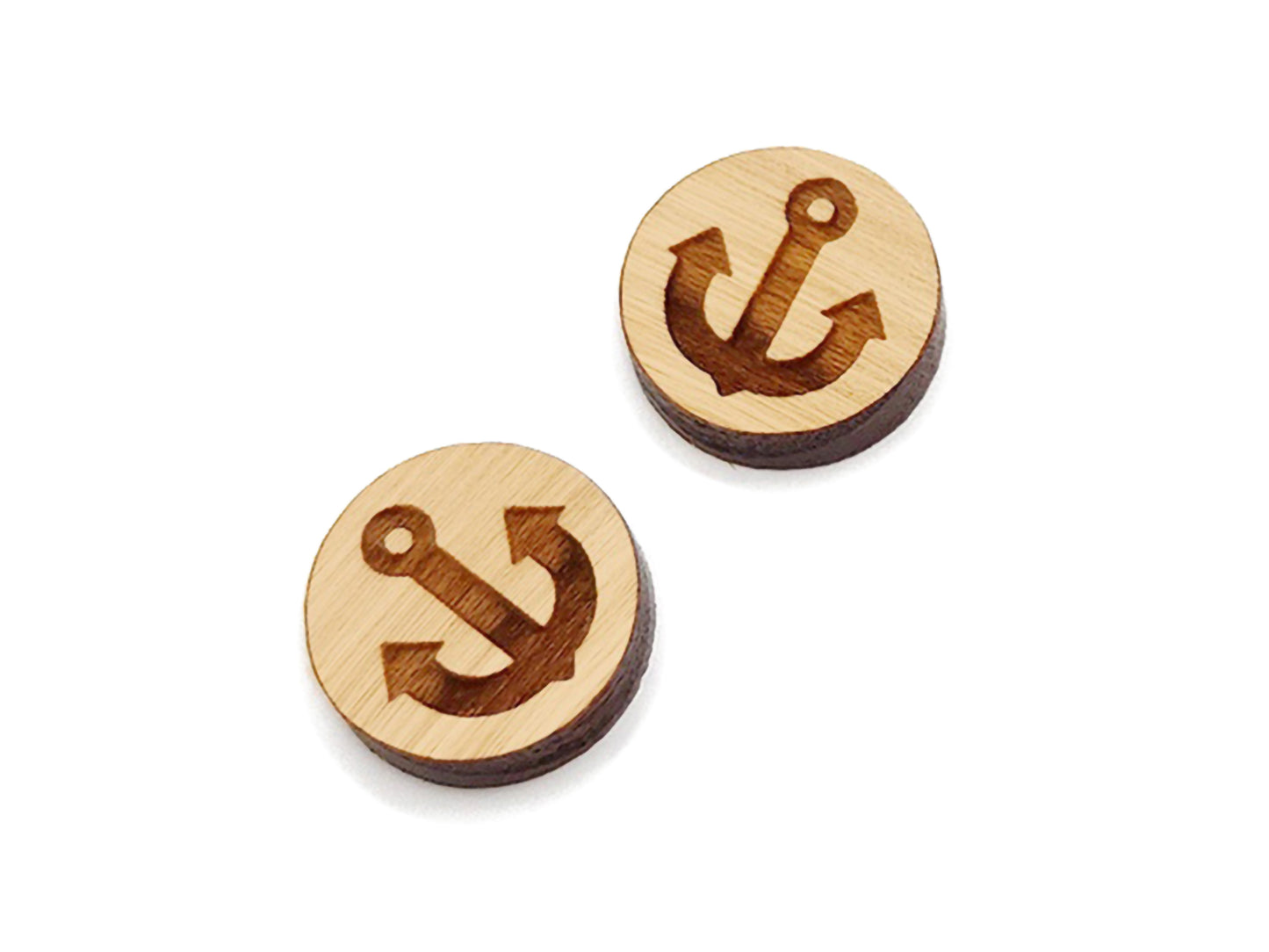 two wooden buttons with an anchor on them