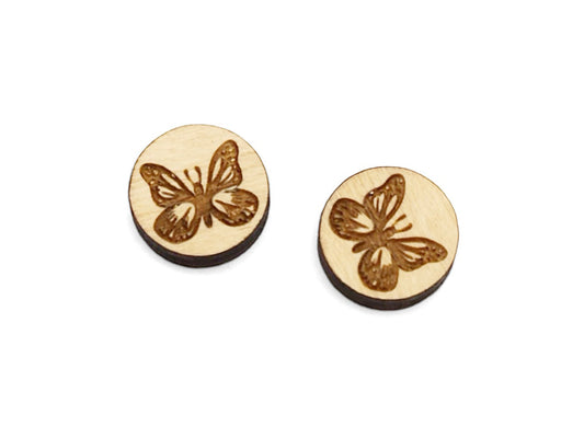 a pair of small round wooden cabochon blank for stud earrings engraved with a butterfly.