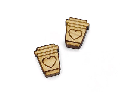 a pair of wooden earrings with a heart on them