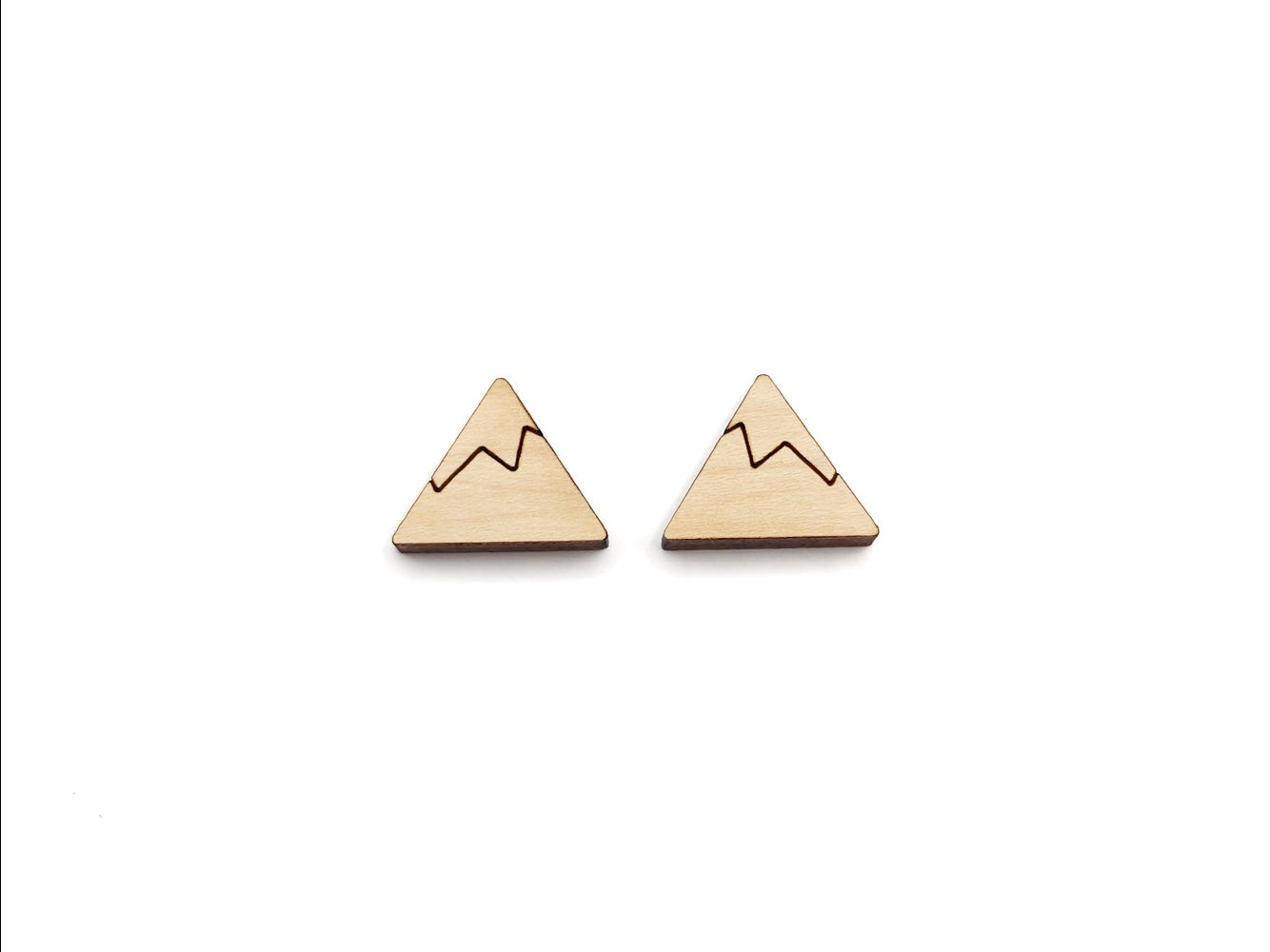 a pair of wooden cabochon stud earring blanks cut and engraved to look like a snow-capped mountain