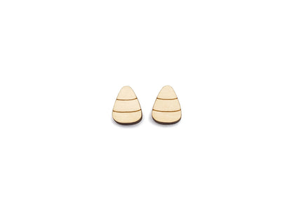 a pair of wooden cabochon stud earring blanks cut and engraved to look like candy corn