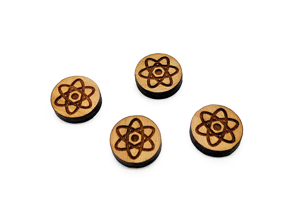 four wooden buttons with a design on them