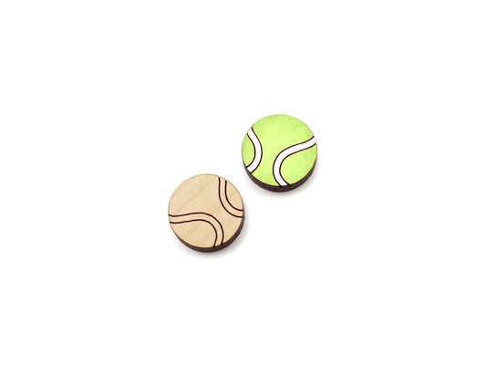 a pair of wooden cabochon stud earring blanks cut and engraved to look like tennis balls