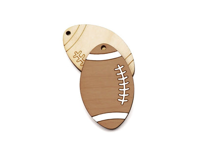 pair of two wood jewelry charm blanks cut and engraved to look like a football