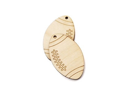 pair of two wood jewelry charm blanks cut and engraved to look like a football