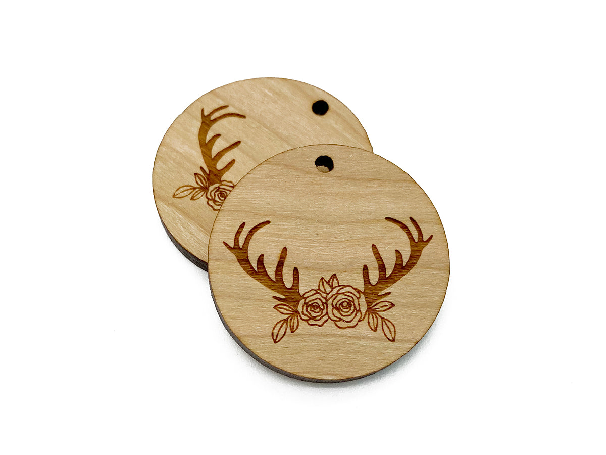 two wooden tags with deer antlers and roses on them