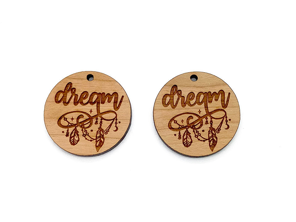 two wooden tags with the words dream on them