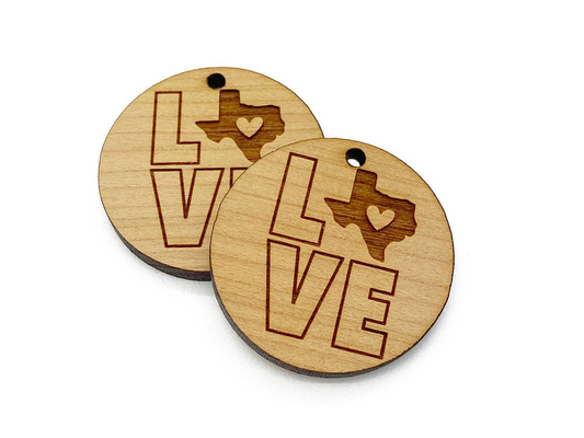 two wooden tags with the word love on them