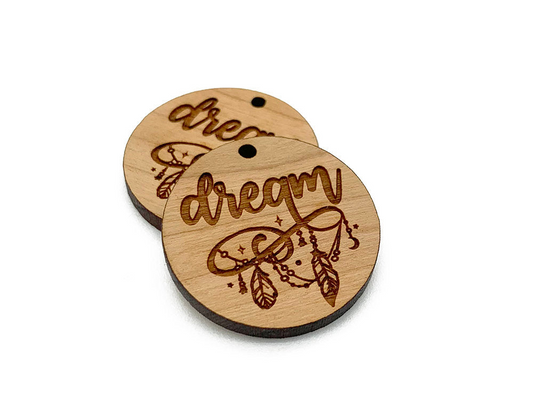 two wooden tags with the words dream on them