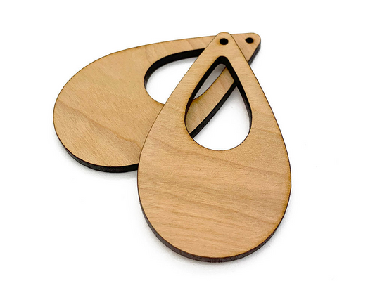 a wooden cutting board with a pair of scissors