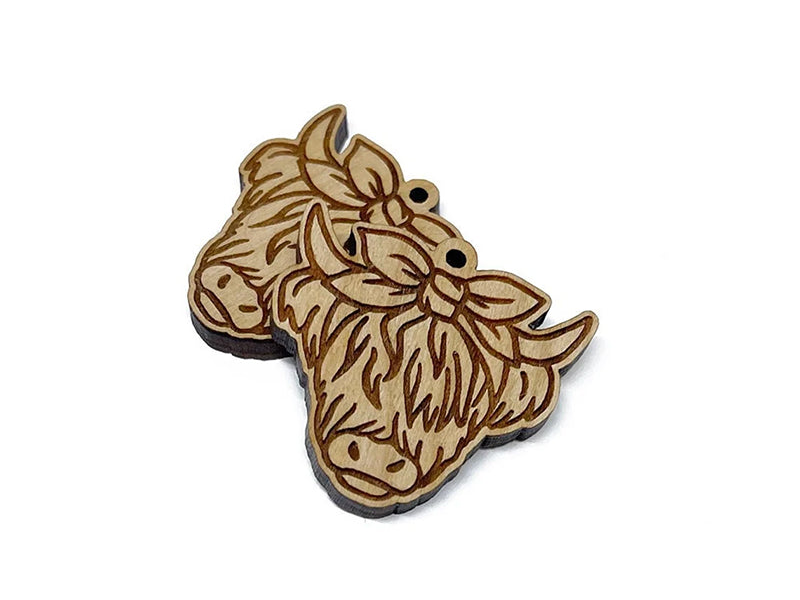a wooden brooch depicting a dog's head