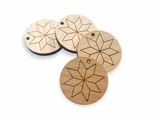 a set of four wooden coasters sitting on top of a table