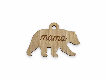 a wooden bear ornament with the word mama on it