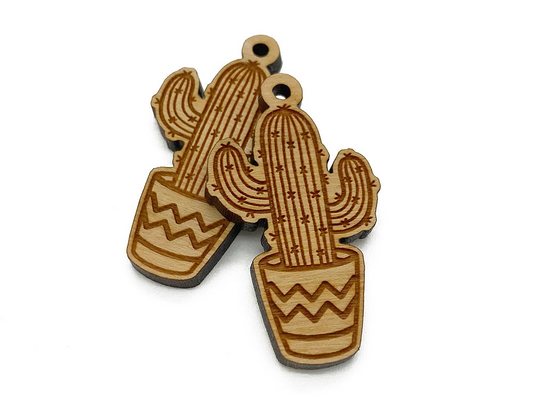 a wooden charm with a cactus on it