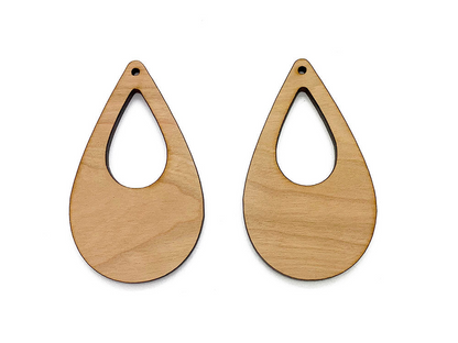 a pair of wooden earrings on a white background