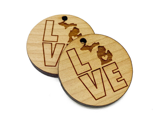 two wooden coasters with the word love on them