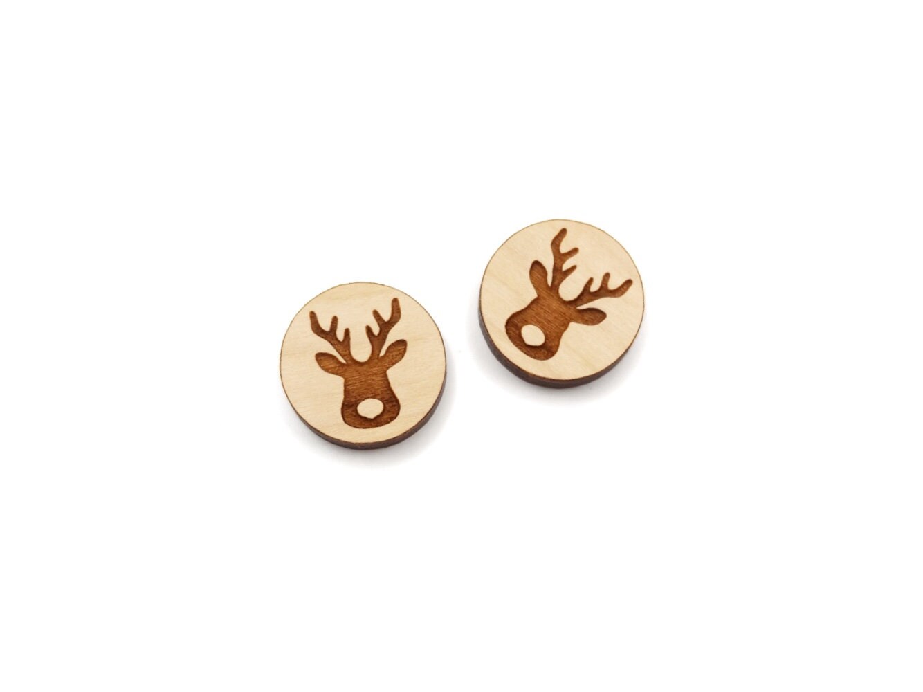 a pair of round wooden cabochon earring blanks engraved with a Christmas Reindeer