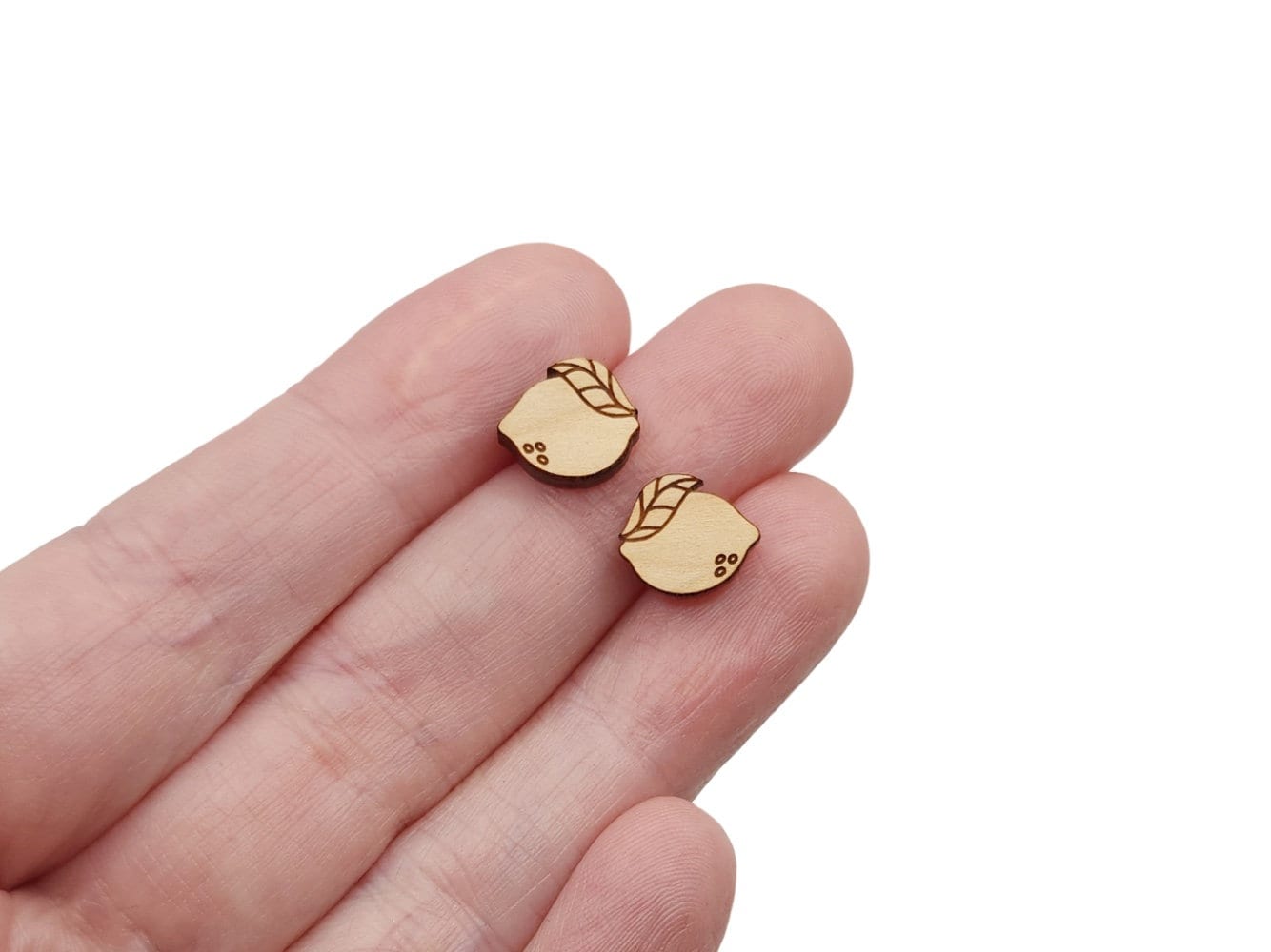 These lemon & leaf engraved flat-back wood cabochon blanks are the perfect size to create stud earrings. You can paint them or keep the natural wood look with stains.